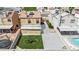 Aerial view of a home with spacious backyard, patio, and a pool at 5845 Killala Ct, Las Vegas, NV 89110
