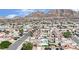 Residential aerial view of houses, pools, and a backdrop of mountains at 5845 Killala Ct, Las Vegas, NV 89110