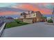 Exterior view of the backyard of the home with green grass at 5845 Killala Ct, Las Vegas, NV 89110