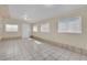 Finished basement with tile floors, three windows, and a door at 5845 Killala Ct, Las Vegas, NV 89110