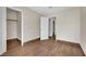 Bright bedroom with wood-look flooring and closet at 5845 Killala Ct, Las Vegas, NV 89110