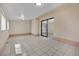 Large bonus room features tile flooring, sliding glass doors, and neutral wall color scheme at 5845 Killala Ct, Las Vegas, NV 89110