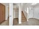 Inviting entryway with tile floors, staircase, storage cabinets and open closet at 5845 Killala Ct, Las Vegas, NV 89110