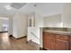 Bright hallway with wood-look tile flooring and natural light from windows at 5845 Killala Ct, Las Vegas, NV 89110