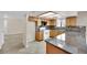 Bright open kitchen features white appliances, backsplash, and wood cabinets at 5845 Killala Ct, Las Vegas, NV 89110