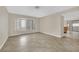 Spacious living room featuring neutral walls, tile floors, and ample natural light at 5845 Killala Ct, Las Vegas, NV 89110