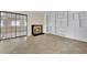 Living room featuring a fireplace, tiled floors, and large shelving unit at 5845 Killala Ct, Las Vegas, NV 89110