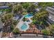 Aerial view of community pools and landscaping, with surrounding residential properties at 609 Greenbriar Townhouse Way, Las Vegas, NV 89121