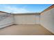 Enclosed backyard with a large brick patio and white painted walls at 609 Greenbriar Townhouse Way, Las Vegas, NV 89121