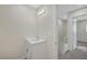 Bathroom with sleek vanity, modern lighting, and neutral wall color at 609 Greenbriar Townhouse Way, Las Vegas, NV 89121