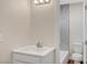 New bathroom featuring a marble tiled shower, white vanity, and a toilet at 609 Greenbriar Townhouse Way, Las Vegas, NV 89121