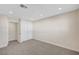 Spacious bedroom with plush carpeting, neutral walls, and a large closet for storage at 609 Greenbriar Townhouse Way, Las Vegas, NV 89121