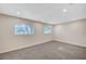 Large bedroom with plush carpeting and lots of natural light at 609 Greenbriar Townhouse Way, Las Vegas, NV 89121