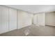 Spacious bedroom features neutral walls, plush carpet, and a large closet at 609 Greenbriar Townhouse Way, Las Vegas, NV 89121