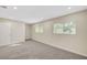 Bright bedroom features neutral walls, plush carpet, and natural light through large windows at 609 Greenbriar Townhouse Way, Las Vegas, NV 89121