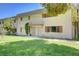 Exterior of the home has a well maintained lawn and a beautiful front yard at 609 Greenbriar Townhouse Way, Las Vegas, NV 89121