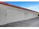 Spacious garages with a clean exterior and ample parking space at 609 Greenbriar Townhouse Way, Las Vegas, NV 89121