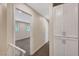 Hallway with carpeted floor, white trim, and view to bedroom at 609 Greenbriar Townhouse Way, Las Vegas, NV 89121