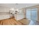 Modern kitchen with stainless steel appliances and white cabinets at 609 Greenbriar Townhouse Way, Las Vegas, NV 89121