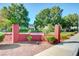 Greenbriar community sign with brick wall, landscaping, and wrought iron fence at 609 Greenbriar Townhouse Way, Las Vegas, NV 89121