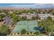 Aerial view of community tennis courts and landscaping, with surrounding residential properties at 609 Greenbriar Townhouse Way, Las Vegas, NV 89121