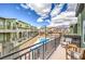 Community view from balcony with outdoor seating and pool at 6437 Wide Sky St, Las Vegas, NV 89166