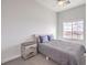 Comfortable bedroom features a window, ceiling fan, and a cozy bed at 6437 Wide Sky St, Las Vegas, NV 89166