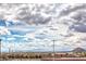 Scenic view overlooking the city with mountains in the distance and a partly cloudy sky at 6437 Wide Sky St, Las Vegas, NV 89166