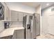 Kitchen featuring stainless steel refrigerator and light gray cabinets and counters at 6437 Wide Sky St, Las Vegas, NV 89166