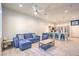 Open-concept living space with kitchen breakfast bar and comfortable furniture at 6437 Wide Sky St, Las Vegas, NV 89166