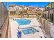Community pool area with a pool, a hot tub, and comfortable seating arrangements at 6437 Wide Sky St, Las Vegas, NV 89166