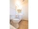 Bathroom with a single sink vanity and white colored walls and accents at 6493 Yellow Bells Ct, Las Vegas, NV 89131