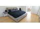 Large main bedroom featuring hardwood floors and a modern aesthetic, offering a luxurious retreat at 6493 Yellow Bells Ct, Las Vegas, NV 89131
