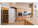 Well-stocked pantry with organized shelving, adjacent to a modern kitchen area at 6493 Yellow Bells Ct, Las Vegas, NV 89131
