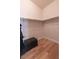 An empty walk-in closet with wood floors and shelves at 6493 Yellow Bells Ct, Las Vegas, NV 89131