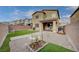 Expansive backyard with low-maintenance gravel, artificial turf, and space for outdoor entertaining at 7109 Red Gulch St, North Las Vegas, NV 89084
