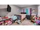 Bedroom with a dark wood bed frame and colorful decor on the walls at 7109 Red Gulch St, North Las Vegas, NV 89084