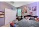 Bedroom with large closet and decorated with posters on the wall at 7109 Red Gulch St, North Las Vegas, NV 89084