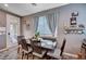 Charming dining area with wood table, seating for four and bright natural light at 7109 Red Gulch St, North Las Vegas, NV 89084