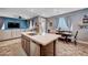 Open concept kitchen with stainless steel appliances overlooks the dining area and living room at 7109 Red Gulch St, North Las Vegas, NV 89084