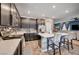 Open-concept kitchen with a center island, modern appliances, and a view into the adjacent living room at 7109 Red Gulch St, North Las Vegas, NV 89084