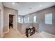 Open loft area with natural light from windows and access to other rooms at 7109 Red Gulch St, North Las Vegas, NV 89084
