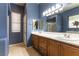 Bathroom featuring double sinks and a large mirror, perfect for morning routines at 7549 Evening Falls Dr Dr, Las Vegas, NV 89131