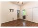 A bright bedroom featuring hardwood floors, neutral walls, closet and bathroom access at 7549 Evening Falls Dr Dr, Las Vegas, NV 89131