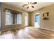 Bright bedroom with wood floors and a door leading to the outside at 7549 Evening Falls Dr Dr, Las Vegas, NV 89131