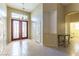 Inviting foyer with high ceilings, decorative lighting, and tile flooring at 7549 Evening Falls Dr Dr, Las Vegas, NV 89131