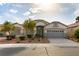 Charming single-story home features a well-manicured lawn and a two-car garage at 7549 Evening Falls Dr Dr, Las Vegas, NV 89131