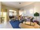 Formal living room featuring stylish furniture, a blue rug, and natural light at 7549 Evening Falls Dr Dr, Las Vegas, NV 89131