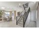 Bright entryway features a staircase, and a dining area with ample natural light from large windows at 8412 Sycamore Creek St, Las Vegas, NV 89113