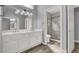 Bathroom featuring double sinks, new fixtures, a glass enclosed shower at 8500 Gull Dr, Las Vegas, NV 89134